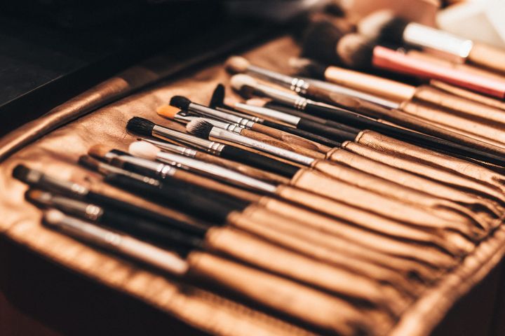 Makeup brushes lined up in a brush roll